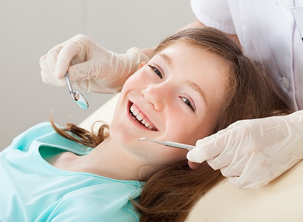 Smiling child in dental chair