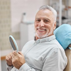 patient smiling after getting dental implants in Queen Creek